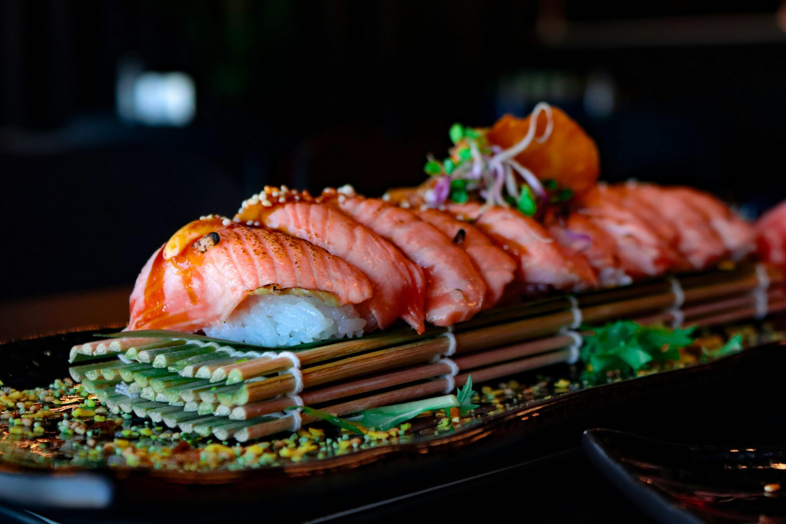 Delight in a beautifully arranged salmon sushi platter, perfect for food lovers and culinary enthusiasts.